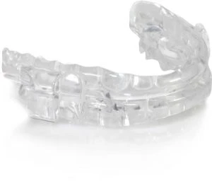 Clear dental appliance used for sleep therapy or teeth alignment.